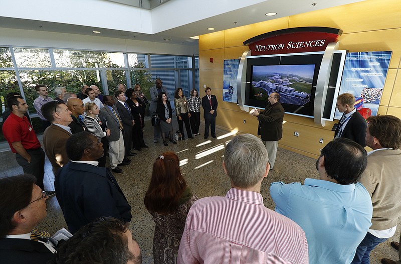 Kenneth Herwig speaks to professionals from Chattanooga as they toured Oak Ridge National Laboratory's Spallation Neutron Source facility in Oak Ridge, Tennessee, in 2015. / Staff File Photo