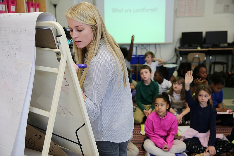 Christin Willingham talks through what students know and asks them what they want to know about landforms while student teaching in Wendy Scruggs' class at Battle Academy Wednesday, March 7, 2018 in Chattanooga, Tenn. Willingham, who is a senior in the University of Tennessee at Chattanooga's School of Education, is doing her student teaching residency in Scruggs' classroom.