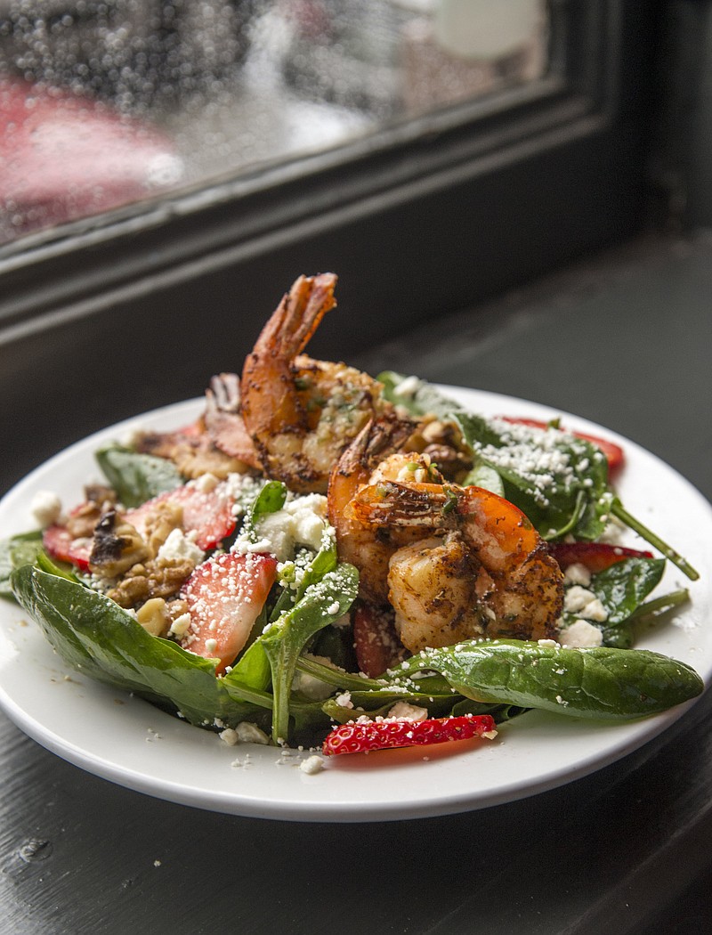 The Strawberry & Feta Salad includes baby spinach, feta cheese, fresh strawberries and toasted walnuts topped with grilled shrimp (for an additional fee.) / Photo by Mark Gilliland