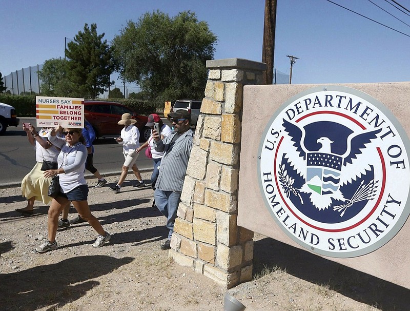 In this June 2018 file photo, protesters walk along Montana Avenue outside the El Paso Processing Center in El Paso, Texas. Nearly 50 Democratic lawmakers called for a watchdog investigation of U.S. Immigration and Customs Enforcement on Tuesday, Feb. 20, 2019, after the agency confirmed it had been force-feeding immigrant detainees on a hunger strike. On Thursday, all force-feeding at the detention center near the El Paso airport abruptly stopped after a U.S. district judge said the government had to stop involuntarily feeding two of the detained immigrants. (Rudy Gutierrez/The El Paso Times via AP)