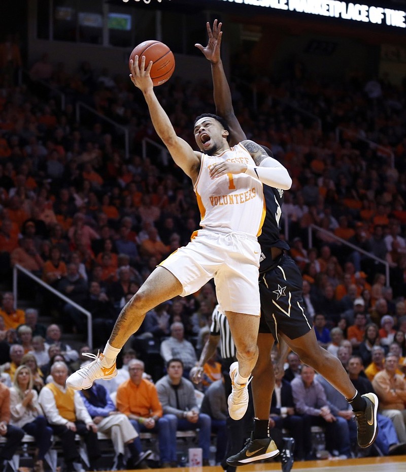 Tennessee guard Lamonte Turner (1) goes for a shot as he's fouled by Vanderbilt guard Maxwell Evans during the first half of an NCAA college basketball game Tuesday, Feb. 19, 2019, in Knoxville, Tenn. (AP photo/Wade Payne)

