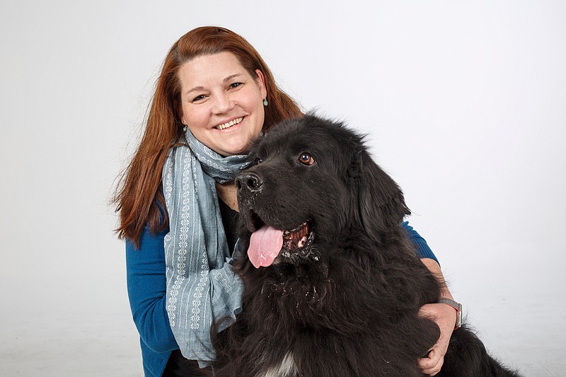 Anna Meiners co-owns the pet-sitting company Sister Sitters with her own sister, Sarah Ward. She says her Newfoundland dog, Kayak, is great at calming the fears of others dogs who stay in their home.