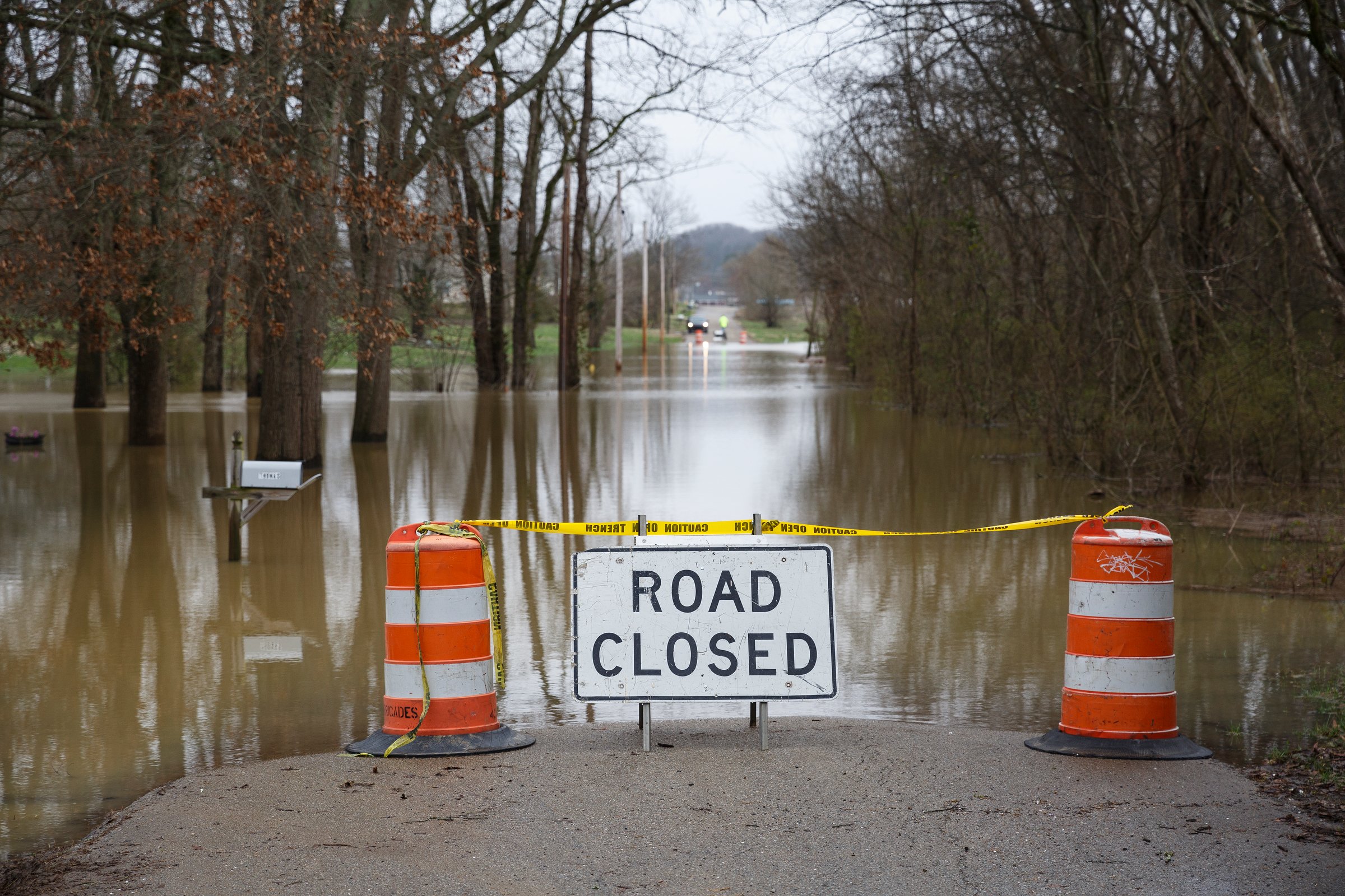 Floodwaters cover Aster Road in Lookout Valley after heavy rainfall on Wednesday, Feb. 20, 2019, in Chattanooga, Tenn. Continuous rain through the week has raised area waterways to flood stages, with more rain expected in the coming days.