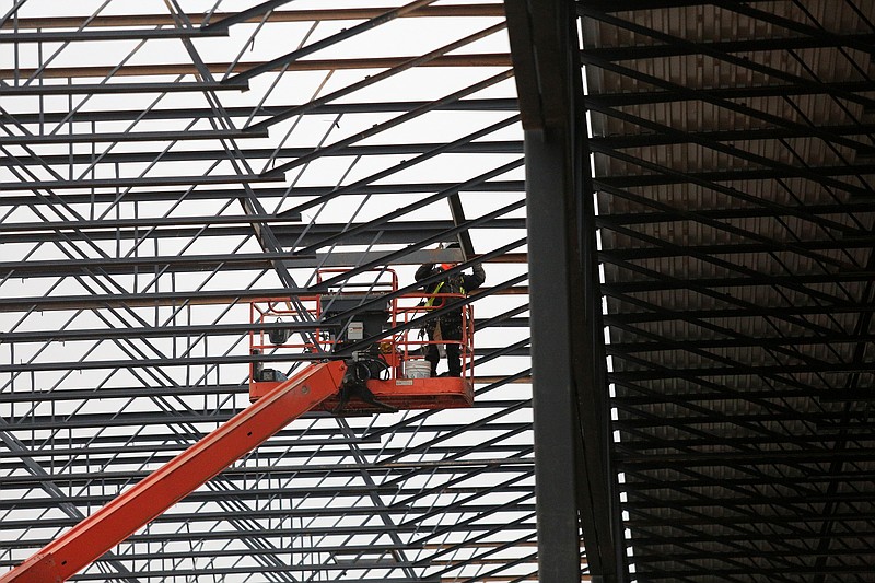 A construction worker welds in the rafters at the new Nokian Tyres plant under construction Wednesday, February 20, 2019 in Dayton, Tennessee. The factory is expected to produce four million tires each year and be able to store as many as 600,000 tires at an onsite distribution facility.
