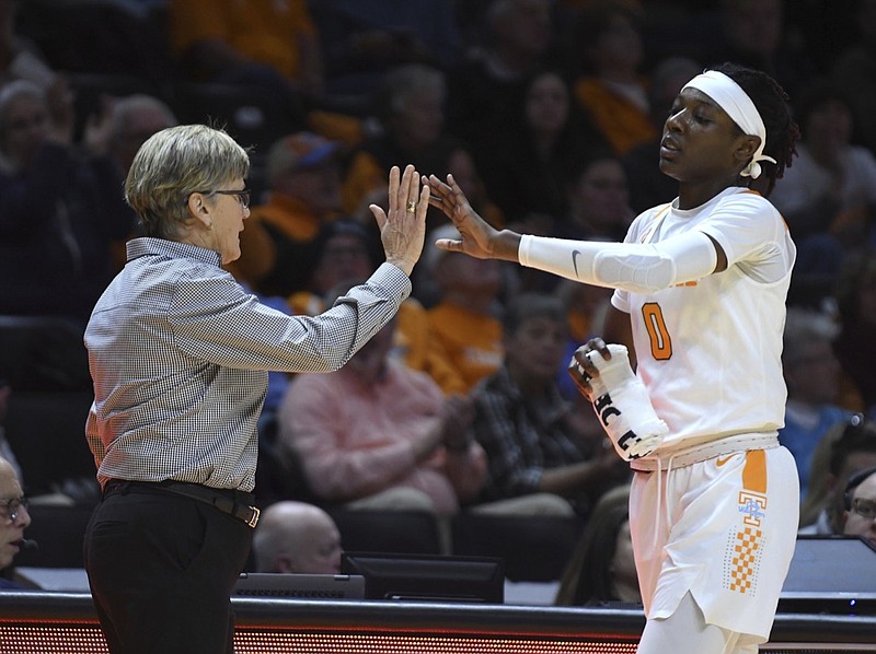 Tennessee women's basketball coach Holly Warlick high-fives Rennia Davis as she comes off the court after the team's 67-50 win over Florida on Jan. 31 in Knoxville. The Lady Vols close their regular-season schedule Sunday at Ole Miss.