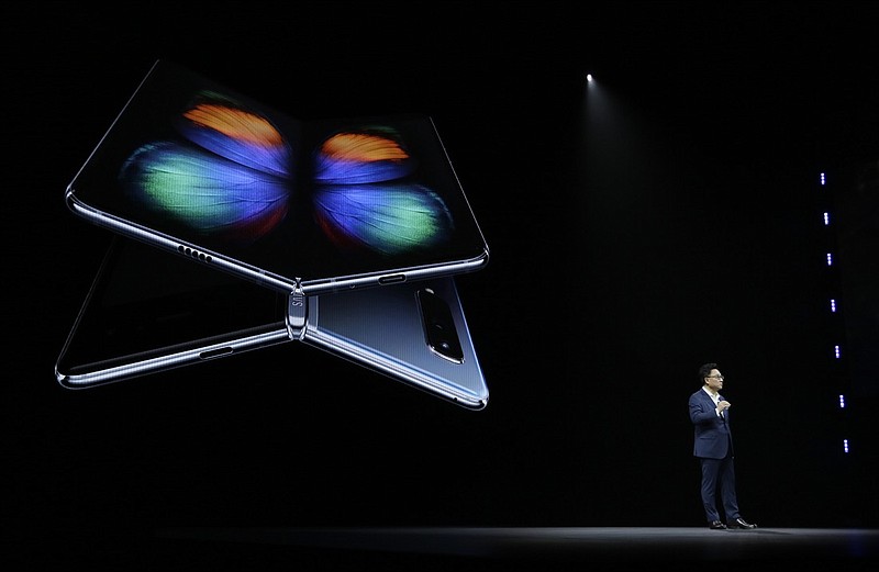 DJ Koh, Samsung President and CEO of IT and Mobile Communications, talks about the new Samsung Galaxy Fold smartphone during an event Wednesday, Feb. 20, 2019, in San Francisco. (AP Photo/Eric Risberg)