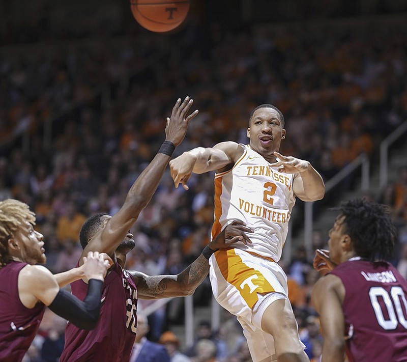 Tennessee's Grant Williams passes under heavy defensive pressure during the Vols' home win against South Carolina on Feb. 13.