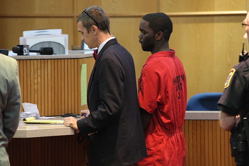 Courtney Birt, middle, stands with his attorney before General Sessions Court Judge Clarence Shattuck during his 2013 trial for killing 16-year-old Lamunta Williams.