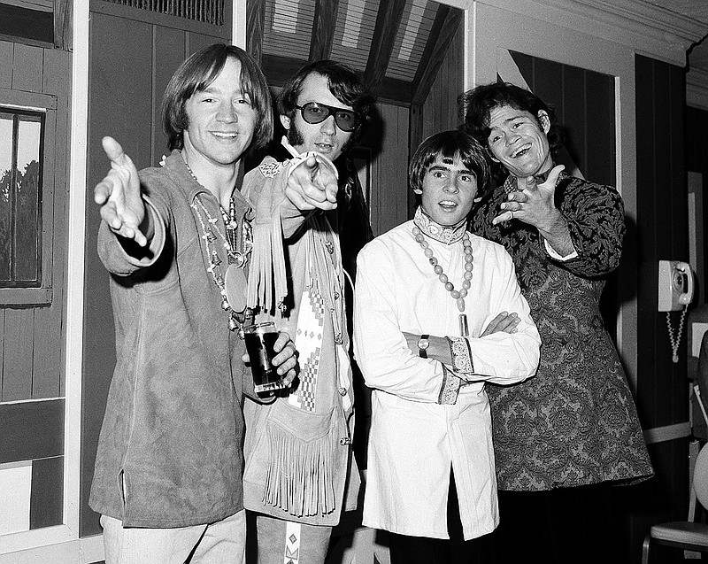 This July 6, 1967 file photo shows, from left, Peter Tork, Mike Nesmith, David Jones and Micky Dolenz of the musical group The Monkees at a news conference at the Warwick Hotel in New York. Tork, who rocketed to teen idol fame in 1965 playing the lovably clueless bass guitarist in the made-for-television rock band The Monkees, died Thursday, Feb. 21, 2019, of complications related to cancer, according to his son Ivan Iannoli. He was 77. (AP Photo/Ray Howard, File)