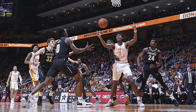 Tennessee's Kyle Alexander (11) is held back by a Vanderbilt player as he looks for the rebound during Tuesday's game in Knoxville. The Vols beat Vanderbilt to bounce back from last Saturday's loss at Kentucky, and defense and rebounding will be crucial for Tennessee again in this Saturday's game at LSU.