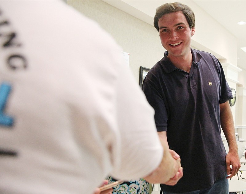 Greg Bradford shakes hands with District 1 Georgia House of Representatives candidate Colton Moore as the final numbers come in for the Georgia House District 1 election at the Dade County County Administrative Building Tuesday, May 22, 2018, in Trenton, Ga. Moore edged out incumbent John Deffenbaugh for the seat.