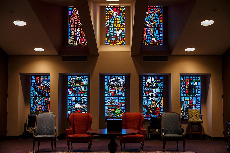 Windows depict the history of Methodism at First-Centenary United Methodist Church on Friday, Feb. 22, 2019, in Chattanooga, Tenn. A special session of the United Methodists General Conference begins Saturday in St. Louis, Mo., where delegates are expected to hear discussion on homosexuality in the Methodist church.