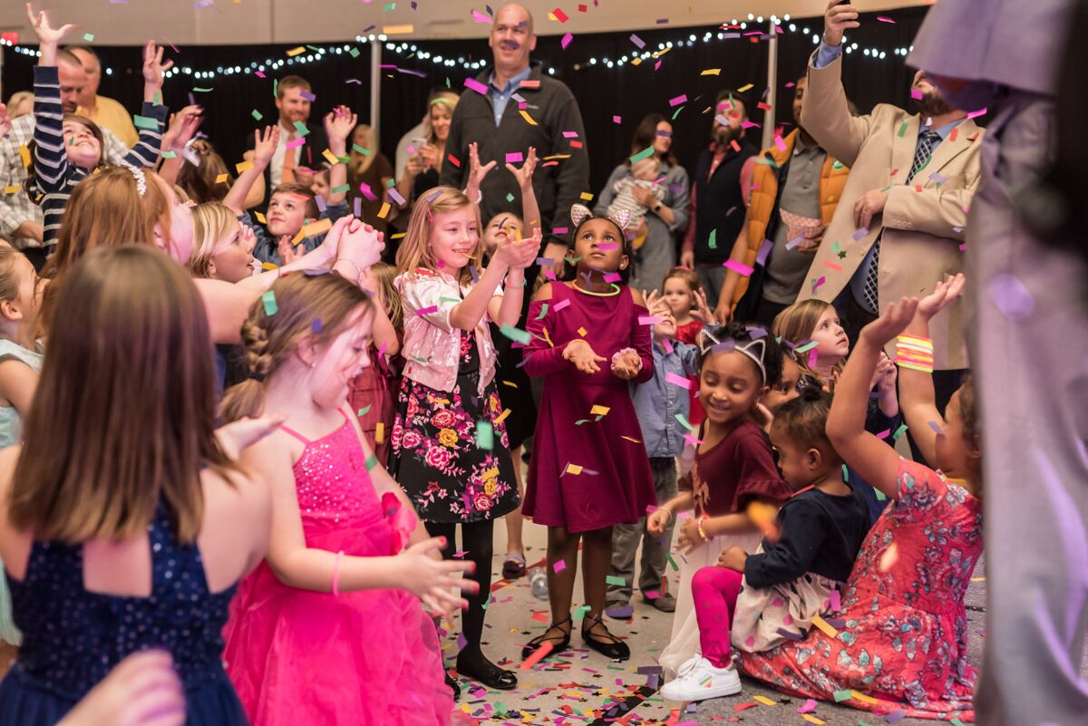 Attendees gather in a shower of confetti shot from a cannon during Ooltewah Elementary's Small Tall Ball. / Contributed photo by Kat Marcum