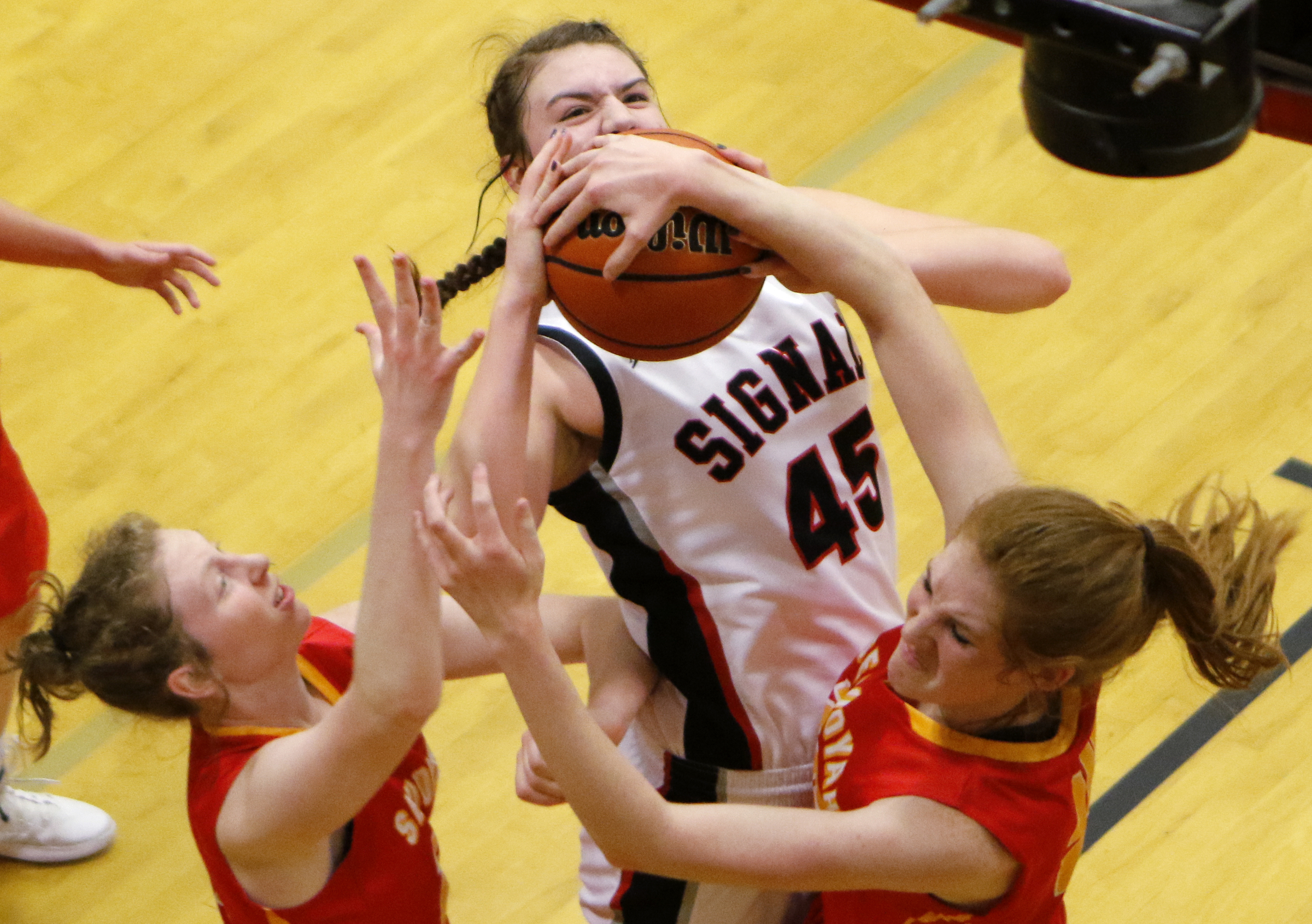 Signal Mountain's Olivia Koontz (45) tries to get off a shot against Sequoyah's Mallorie Harrell, right, after being fouled by Grace Wiggins, left, during the Region 3-AA quarterfinals at Signal Mountain Middle/High School on Friday, Feb. 22, 2019 in Signal Mountain, Tenn.