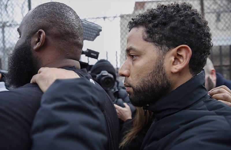 "Empire" actor Jussie Smollett leaves Cook County jail following his release, Thursday, Feb. 21, 2019, in Chicago. Smollett was charged with disorderly conduct and filling a false police report when he said he was attacked in downtown Chicago by two men who hurled racist and anti-gay slurs and looped a rope around his neck, a police official said. (AP Photo/Kamil Krzaczynski)
