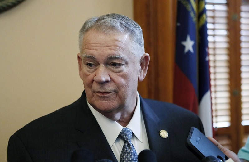 House Speaker David Ralston talks to media on Friday, Feb. 22, 2019 in Atlanta. A member of the Georgia House is calling for the powerful speaker to resign amid reports that he repeatedly used his office to delay court proceedings for criminal defendants, some accused of violent crimes, that he represents as an attorney. The resolution, introduced Friday, encourages Ralston to resign over what it calls an "unacceptable abuse of power and professional judgment." (Bob Andres/Atlanta Journal-Constitution via AP)