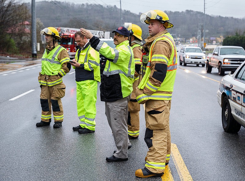 Emergency crews work the scene after an overnight mudslide destroyed a Subway restaurant on Signal Mountain Road on Saturday, Feb. 23, 2019, in Chattanooga, Tenn. Subway manager Robbie Anderson said that the restaurant had closed at about 2:00 on Friday for safety after two trees fell from the hillside.