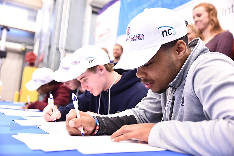 High school seniors commit to Chattanooga State Community College's Tennessee College of Applied Technology (TCAT) program during the college's third annual CTE National Signing Day. Photo courtesy of Chattanooga State. Contributed Photo/Times Free Press