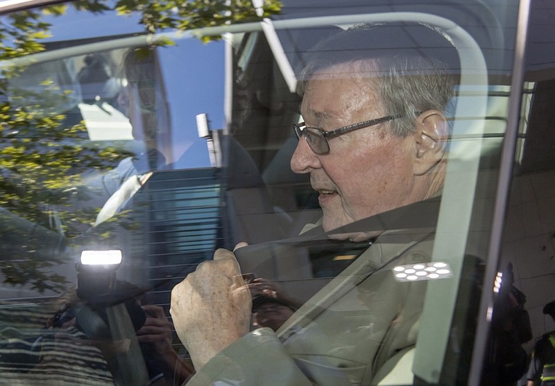 In this Friday, Feb. 22, 2019, photo, Cardinal George Pell leaves the County Court in Melbourne, Australia. The most senior Catholic cleric ever charged with child sex abuse has been convicted Tuesday, Feb. 26, 2019 of molesting two choirboys moments after celebrating Mass, dealing a new blow to the Catholic hierarchy's credibility after a year of global revelations of abuse and cover-up. (AP Photo/Andy Brownbill)

