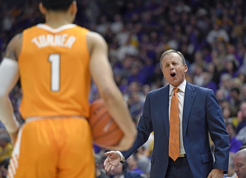 Tennessee head coach Rick Barnes, right, shouts instructions to his players in the first half of an NCAA college basketball game, Saturday, Feb. 23, 2019, in Baton Rouge, La. (AP Photo/Bill Feig)