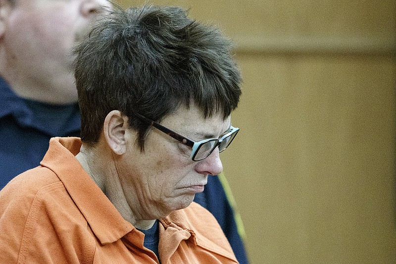 Janet Hinds is lead into the courtroom to appear before Judge Christie Sell in the Chattanooga-Hamilton County Courts Building on Monday, Feb. 25, 2019, in Chattanooga, Tenn. Hinds is charged with vehicular homicide, among nine total charges, in the hit-and-run death of Chattanooga Police Officer Nicholas Galinger. Judge Sell set Hinds' bond to $300,000.