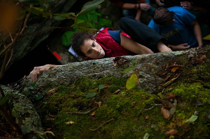 A spotter stands below an unseen climber at Hound Ears in Boone, North Carolina, during the first competition of the annual Triple Crown bouldering series. (Photo contributed by Rock/Creek)