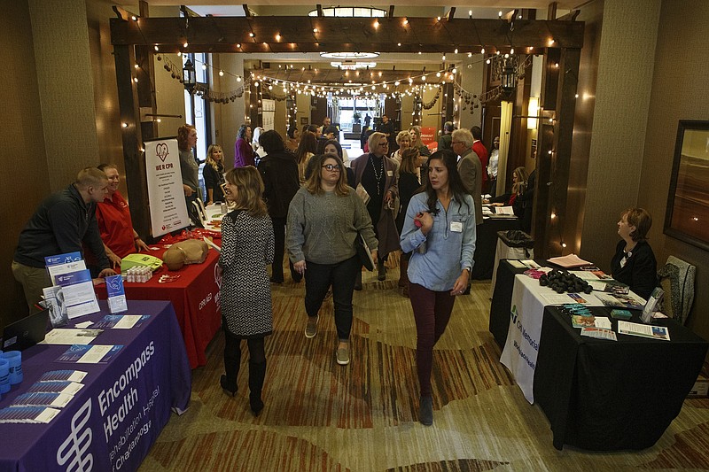 People visit booths during the American Heart Association 2019 Chattanooga Worksite Wellness Summit at the Embassy Suites by Hilton in January.