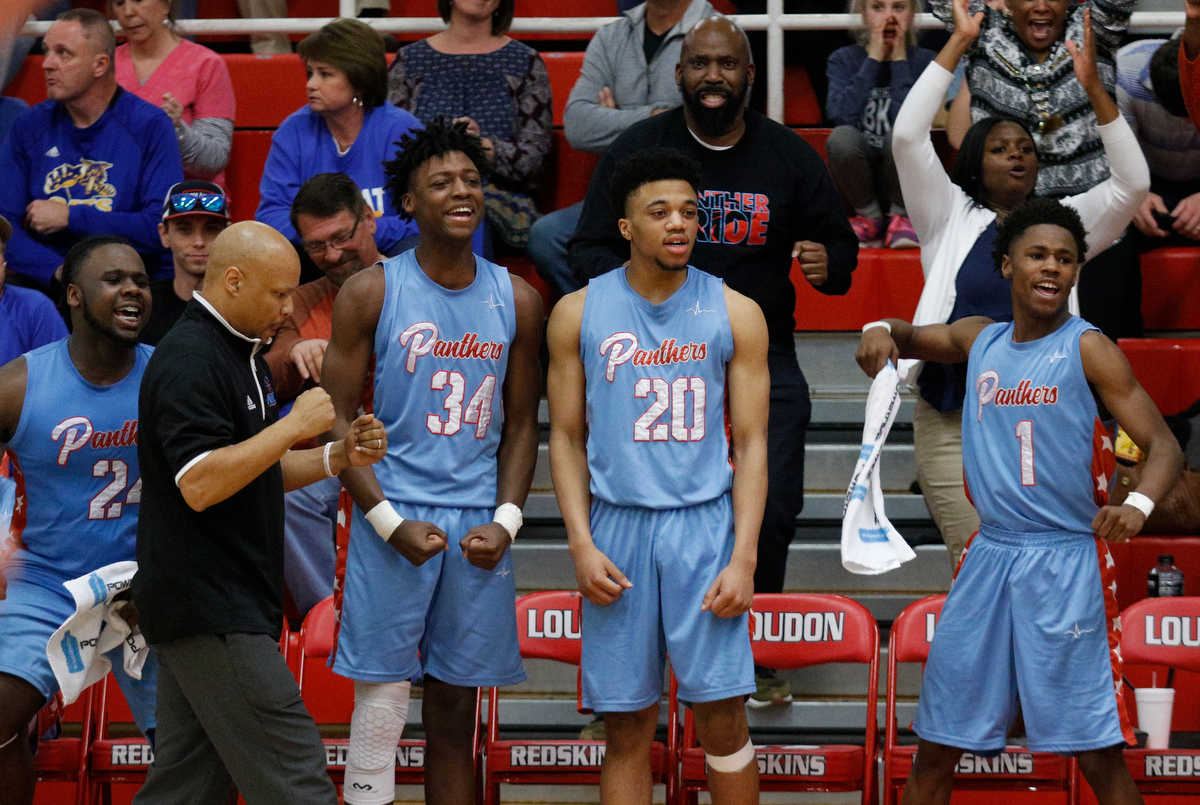 The Brainerd bench celebrates their go-ahead basket in the 4th period of the Panthers' Region 3-AA basketball tournament semifinal game against Sweetwater at Loudon High School on Tuesday, Feb. 26, 2019, in Loudon, Tenn. Brainerd won 70-65.