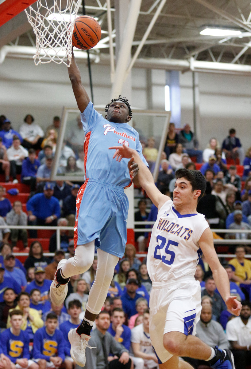 Brainerd's Trey Owten shoots over Sweetwater's Bryce Johnson during the Panthers' Region 3-AA basketball tournament semifinal game against Sweetwater at Loudon High School on Tuesday, Feb. 26, 2019, in Loudon, Tenn.