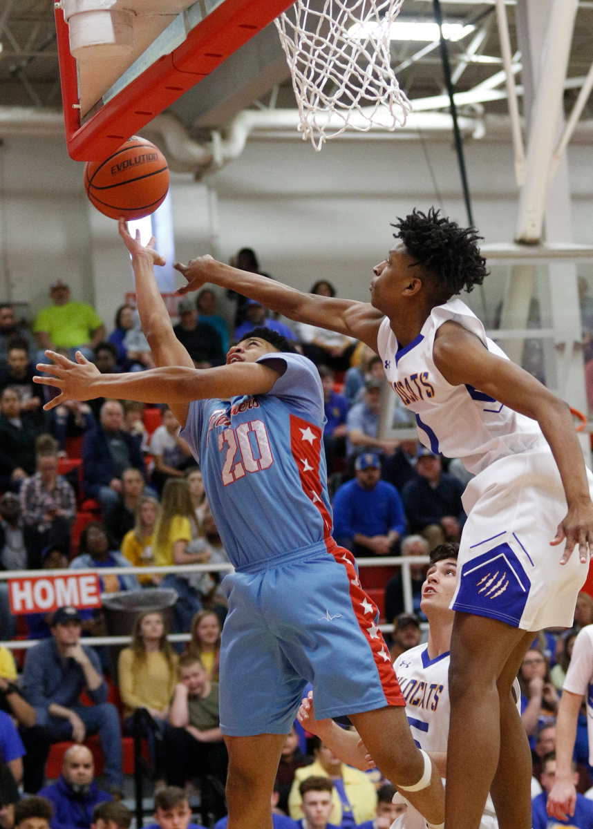 Brainerd's Jonte Williams shoots around Sweetwater's Dominique Oggs during the Panthers' Region 3-AA basketball tournament semifinal game against Sweetwater at Loudon High School on Tuesday, Feb. 26, 2019, in Loudon, Tenn.