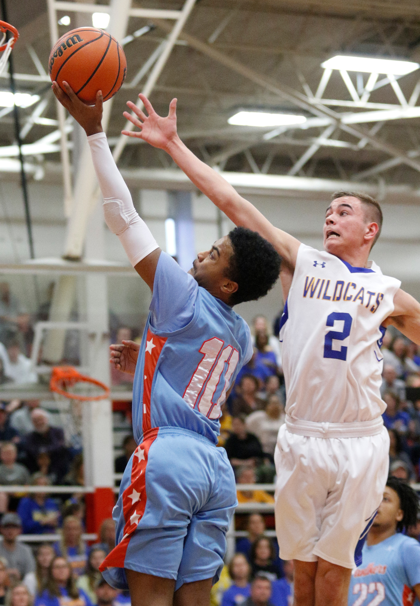 Brainerd's Kevin Halfacre Jr. shoots ahead of Sweetwater's Austin Long during the Panthers' Region 3-AA basketball tournament semifinal game against Sweetwater at Loudon High School on Tuesday, Feb. 26, 2019, in Loudon, Tenn.