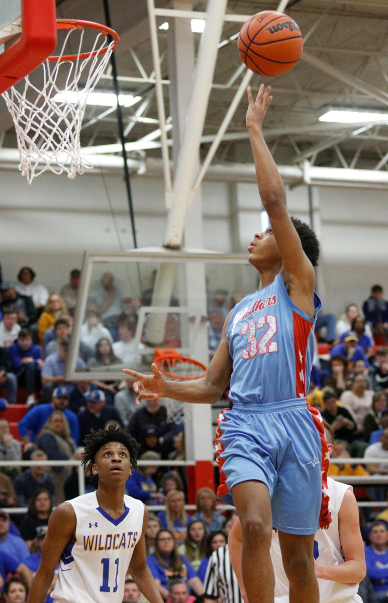 Brainerd's Cameron Evans shoots over Sweetwater's Dominique Oggs during the Panthers' Region 3-AA basketball tournament semifinal game against Sweetwater at Loudon High School on Tuesday, Feb. 26, 2019, in Loudon, Tenn.