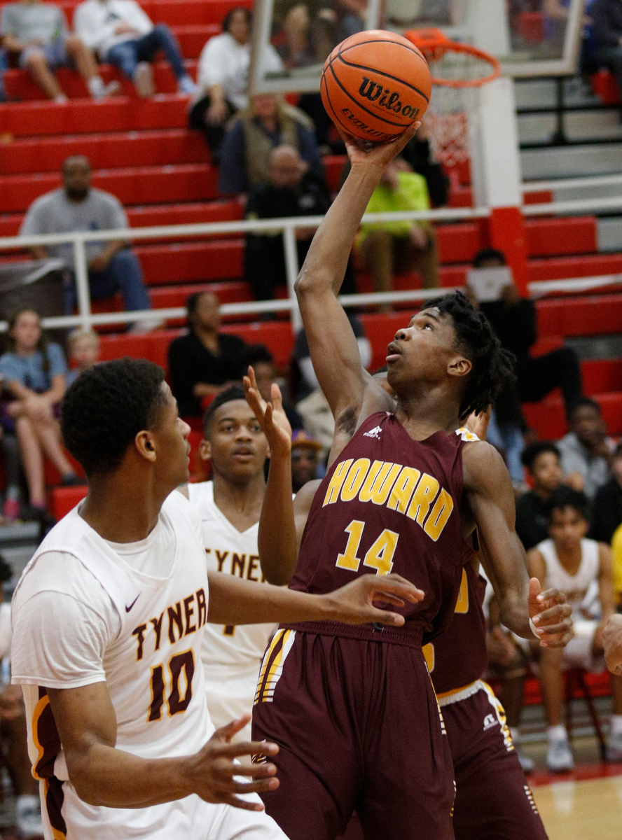 Howard's Kerrick Thorne shoots near Tyner's Soloman Bridgeman (10) during their Region 3-AA basketball tournament semifinal game at Loudon High School on Tuesday, Feb. 26, 2019, in Loudon, Tenn. Brainerd won 70-65.