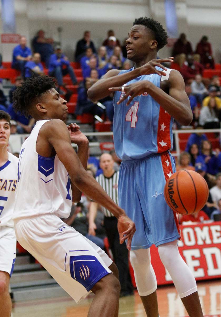 Sweetwater's Dominique Oggs, left, knocks down a shot by Brainerd's LaDerron Freeman during the Panthers' Region 3-AA basketball tournament semifinal game against Sweetwater at Loudon High School on Tuesday, Feb. 26, 2019, in Loudon, Tenn.