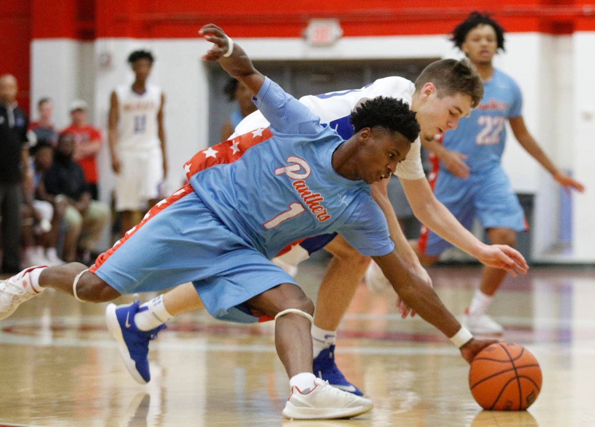 Brainerd's Romeo Hubbard stretches to pick up a loose ball from Sweetwater's Matthew Kile during the Panthers' Region 3-AA basketball tournament semifinal game against Sweetwater at Loudon High School on Tuesday, Feb. 26, 2019, in Loudon, Tenn.