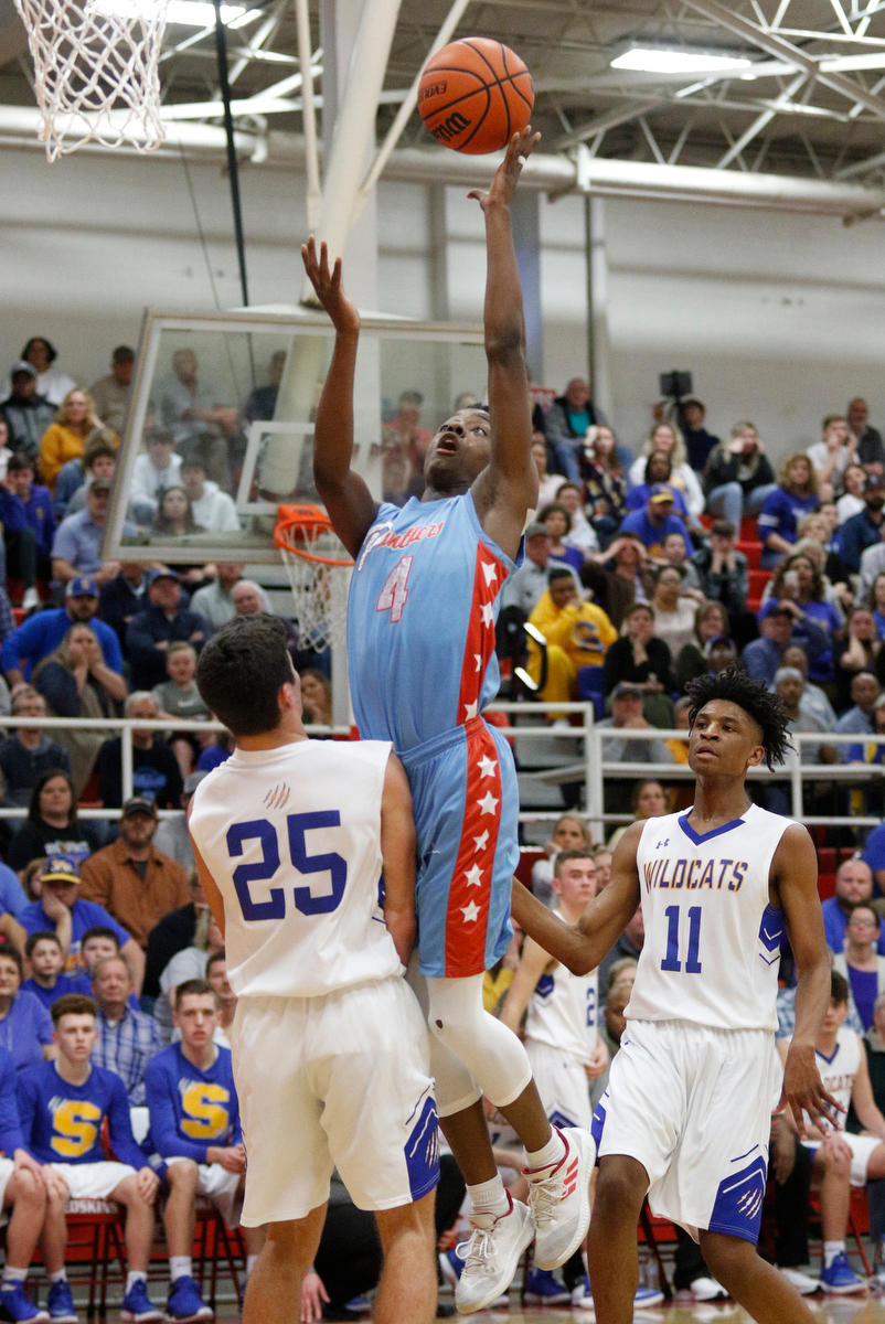 Brainerd's LaDerron Freeman shoots over Sweetwater's Bryce Johnson during the Panthers' Region 3-AA basketball tournament semifinal game against Sweetwater at Loudon High School on Tuesday, Feb. 26, 2019, in Loudon, Tenn.