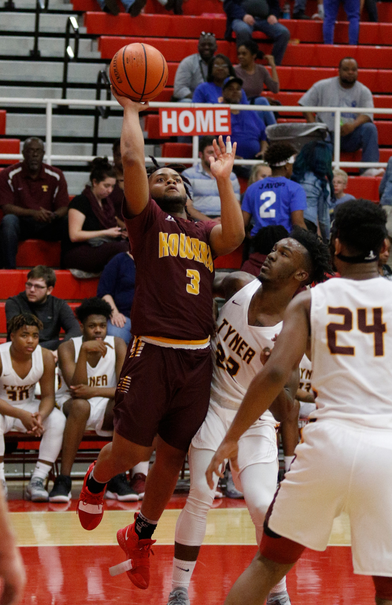 Howard's Marquez Williams, left, shoots around Tyner's Amon Grace during their Region 3-AA basketball tournament semifinal game at Loudon High School on Tuesday, Feb. 26, 2019, in Loudon, Tenn. Brainerd won 70-65.