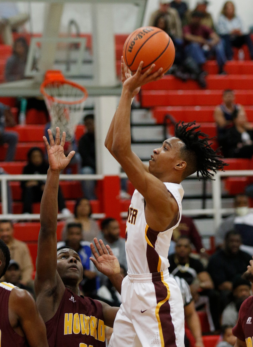 Tyner's Kameron Dozier shoots over Howard's Calvin James during their Region 3-AA basketball tournament semifinal game at Loudon High School on Tuesday, Feb. 26, 2019, in Loudon, Tenn. Brainerd won 70-65.