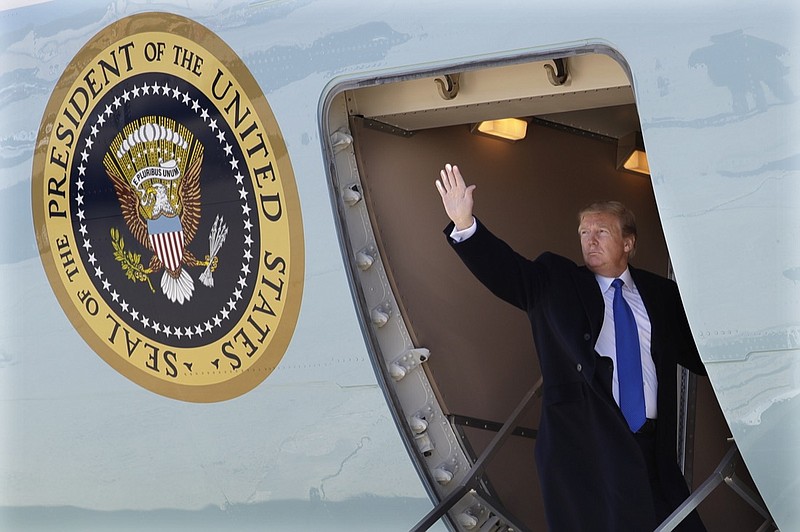 President Donald Trump waves while boarding Air Force One for a trip to Vietnam to meet with North Korean leader Kim Jong Un, Monday, Feb. 25, 2019, in Andrews Air Force Base, Md. (AP Photo/ Evan Vucci)