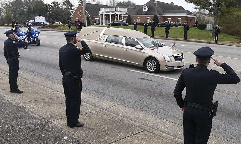 Chattanooga Police Department officers escort the body of Officer Nicholas Galinger on the first leg of the journey from Heritage Funeral Home on East Brainerd to where he will be buried in Cincinnati, Ohio. Other CPD officers were joined by police from other agencies as they lined the road to honor Galinger on February 27, 2019.
