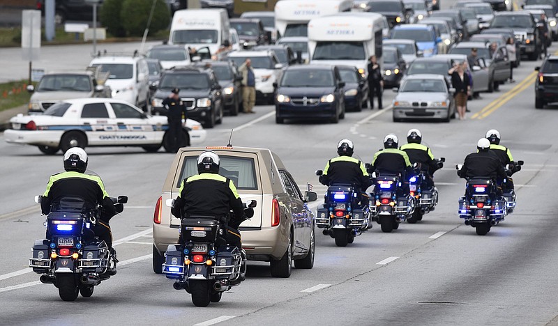 Staff Photo by Robin Rudd
Chattanooga Police Department officers escort the body of Officer Nicholas Galinger, on the first leg of the journey, from Heritage Funeral Home on East Brainerd to where he will be buried in Cincinnati, Ohio. Other CPD officers were joined by police from other agencies as they lined the road to honor Galinger on February 27, 2019.