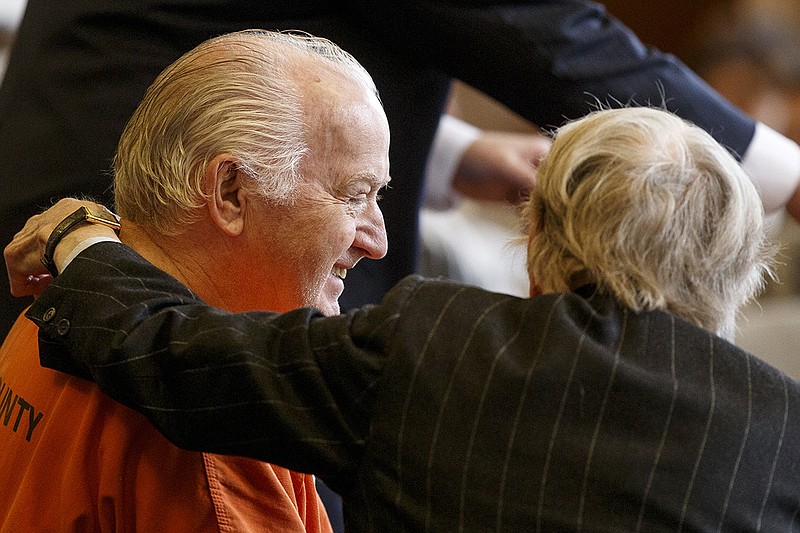 Samuel Alfred Street smiles as his attorney Bobby Lee Cook, right, puts his arm around him after Street was granted bond by Judge Don Thompson at the Walker County Courthouse on Wednesday, Feb. 27, 2019. in LaFayette, Ga. Street is accused of shooting and killing Justin Corey Alfrey in Rising Fawn, Ga., on the night of Dec. 15, 2018.