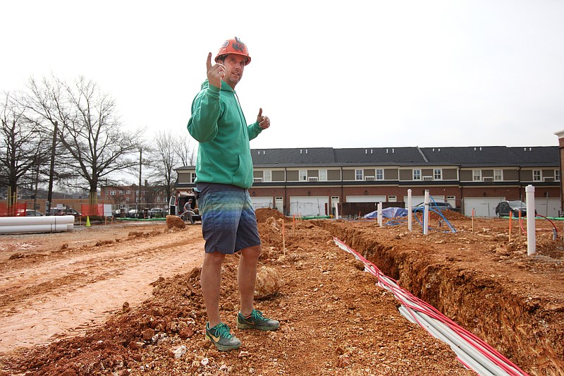 Clint Ball, the project manager for Tower Construction, talks about new work at the Walnut Hill Townhomes complex Wednesday, February 27, 2019 in Chattanooga, Tennessee. The electrical conduits were being placed in the ground Wednesday.