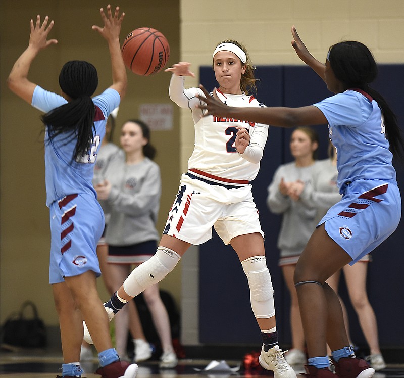 Heritage's Ansley Bice passes as she tries to break the pressure defense of Carver-Columbus during a GHSA Class AAAA state quarterfinal Wednesday night in Ringgold, Ga. Bice finished with 11 points as the Lady Generals' season ended with a 71-43 loss.