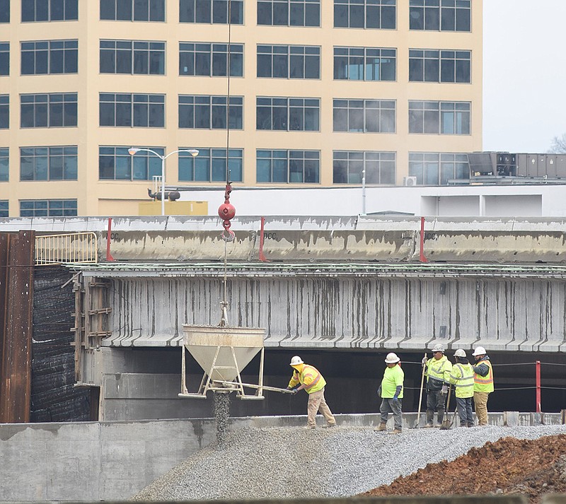 Bridge construction continues on the widening of the overpass at M.L. King Boulevard and U.S. Highway 27, as workers use fill for support on a newly built retaining wall, Thursday, Feb. 28, 2019. / Staff photo by Tim Barber