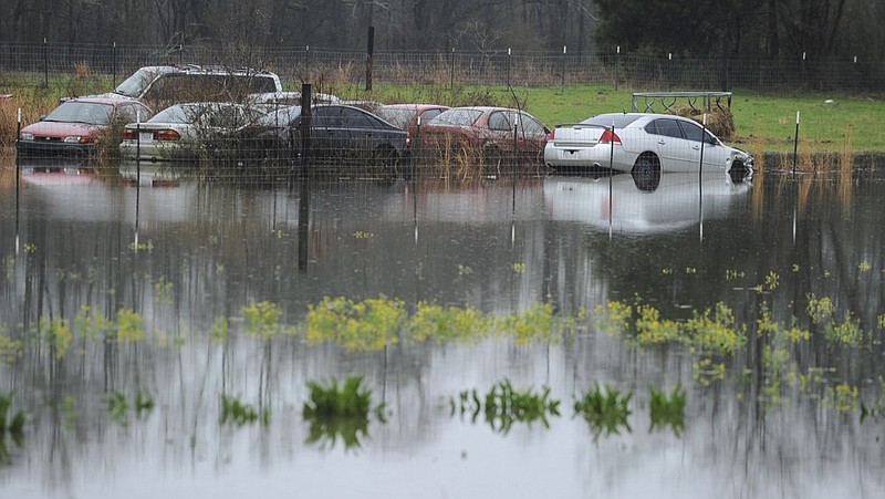 A backyard on Pryor Road in Limestone County is flooded on Friday, Feb. 22, 2019, in Decatur, Ala. More than 30 school districts in Alabama, Mississippi and Tennessee closed Friday, in part because school buses couldn't navigate flooded roads. (Jeronimo Nisa/The Decatur Daily via AP)

