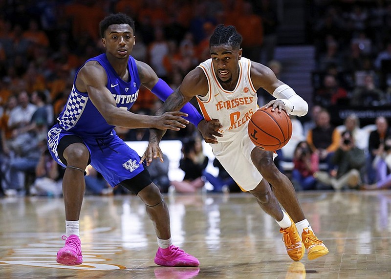 Tennessee point guard Jordan Bone drives past Kentucky guard Ashton Hagans during the second half of Saturday's game in Knoxville. Bone scored 27 points to lead the Vols to a 71-52 victory.