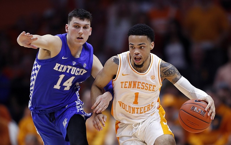 Tennessee guard Lamonte Turner (1) drives against Kentucky guard Tyler Herro (14) during the second half of an NCAA college basketball game Saturday, March 2, 2019, in Knoxville, Tenn. Tennessee won 71-52. (AP Photo/Wade Payne)