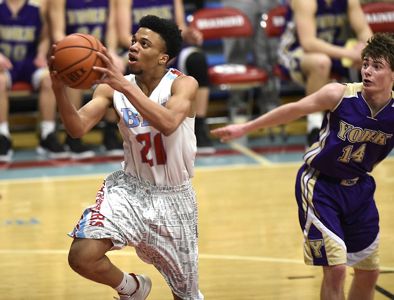 Brainerd's Jonte Williams (20) goes in for a layup past York's Case Moody (14).  The Brainerd High Panthers hosted the York Institute Dragons in a Class AA TSSAA sectional game on March 4, 2019.  