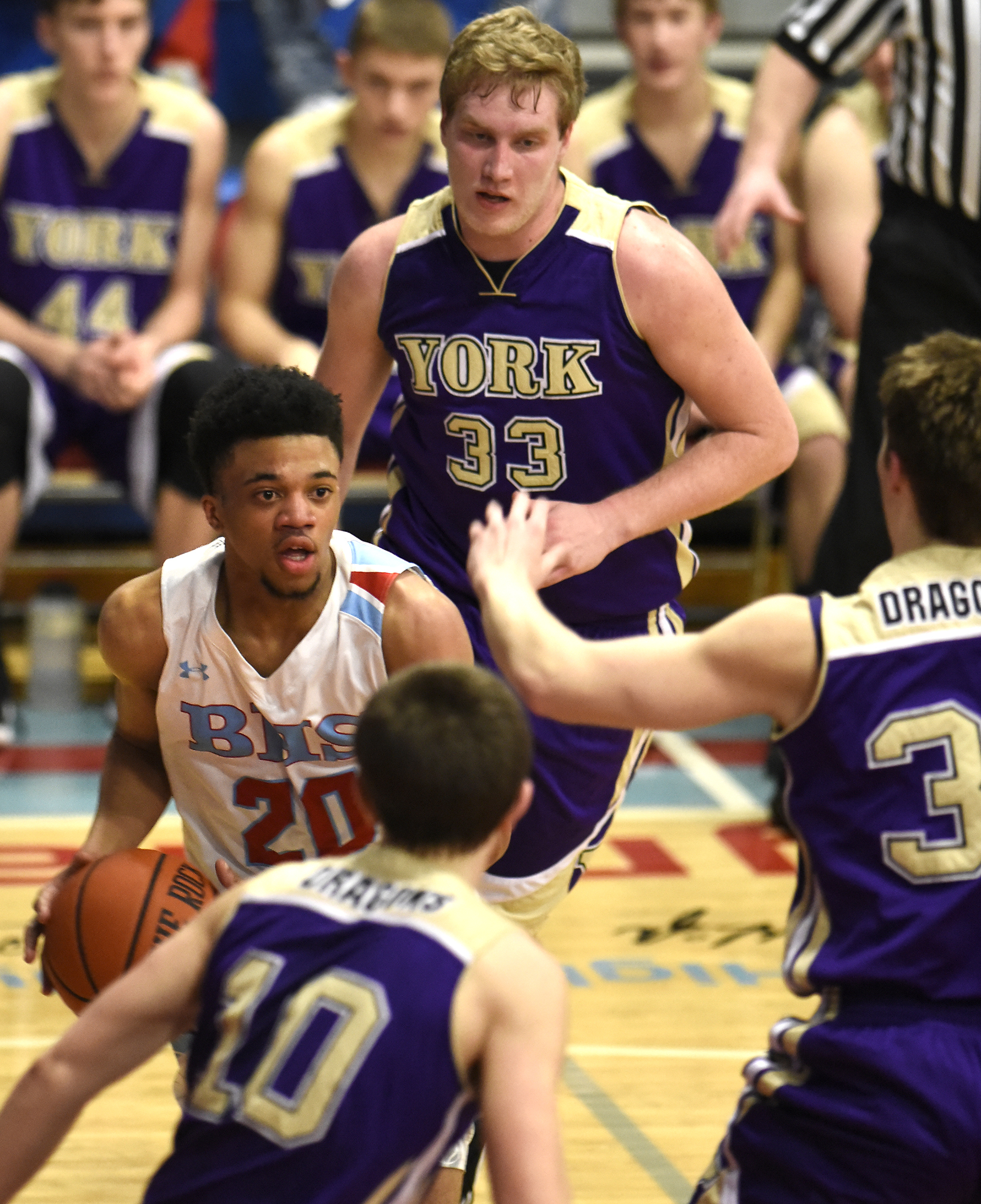Brainerd's Jonte Williams (20) finds himself surrounded by Dragons as he tries to drive the baseline. The Brainerd High Panthers hosted the York Institute Dragons in a Class AA TSSAA sectional game on March 4, 2019.
